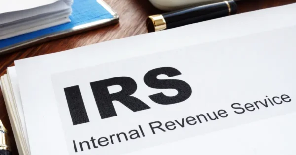 IRS letterhead on wood desk